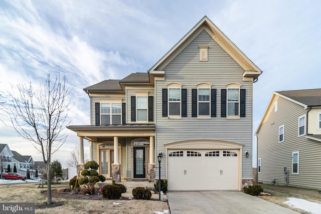 view of front of home with a garage and a porch