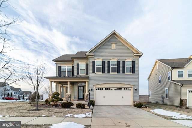 view of front of home featuring a porch and a garage