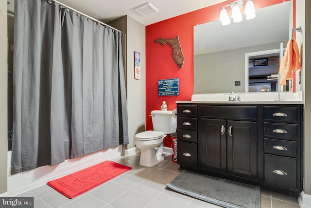 full bathroom featuring vanity, shower / tub combo, tile patterned floors, and toilet