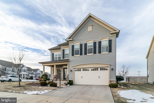 view of front of home with a garage and covered porch