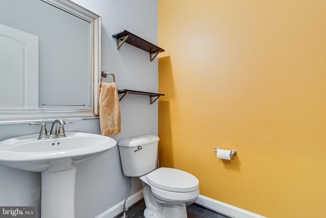 bathroom featuring sink and toilet