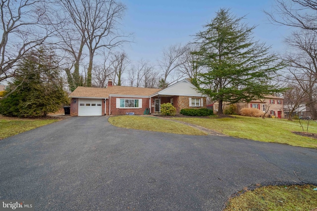 view of front facade with a garage and a front lawn