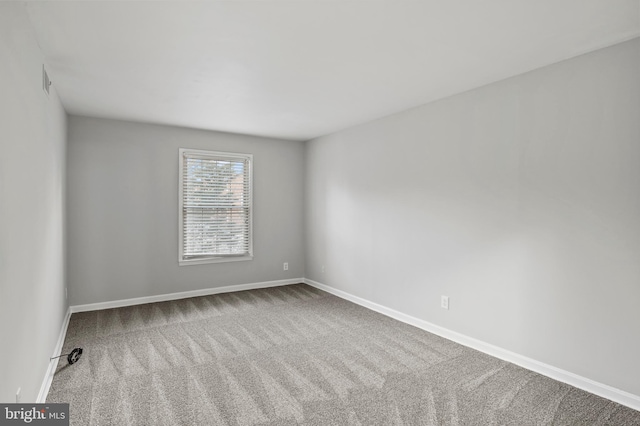 spare room with carpet flooring