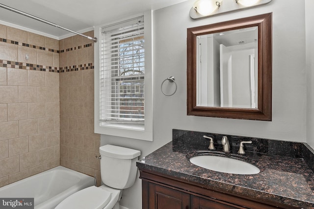 full bathroom featuring vanity, toilet, and tiled shower / bath combo