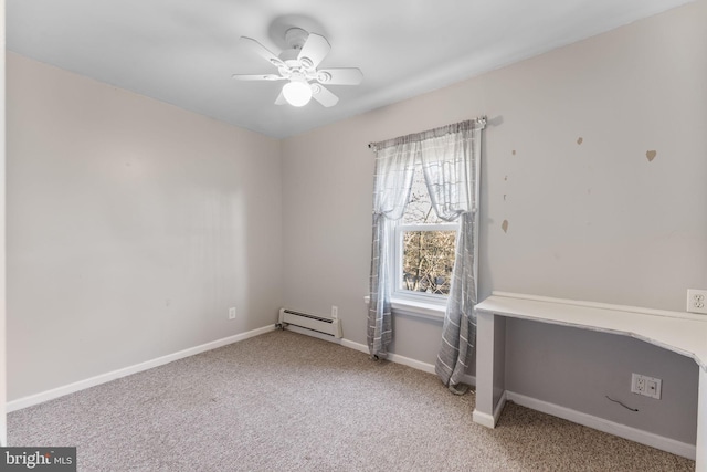 carpeted spare room featuring a baseboard heating unit and ceiling fan