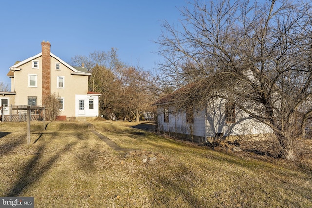 view of home's exterior featuring a lawn