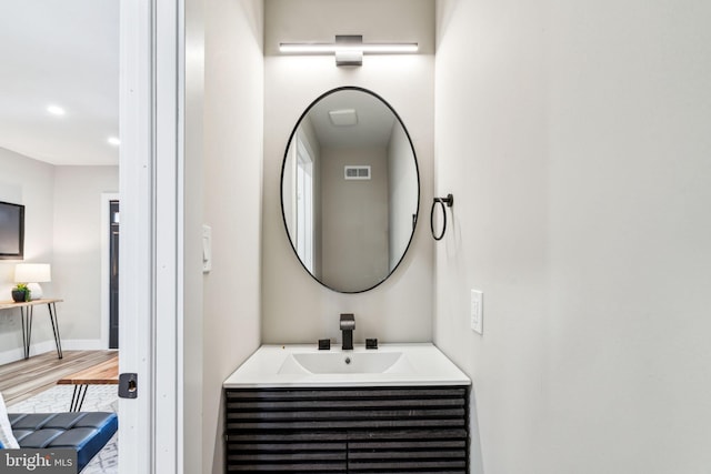 bathroom featuring vanity and hardwood / wood-style flooring