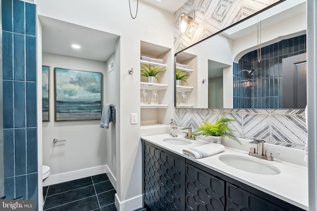 bathroom with backsplash, tile patterned floors, vanity, and toilet