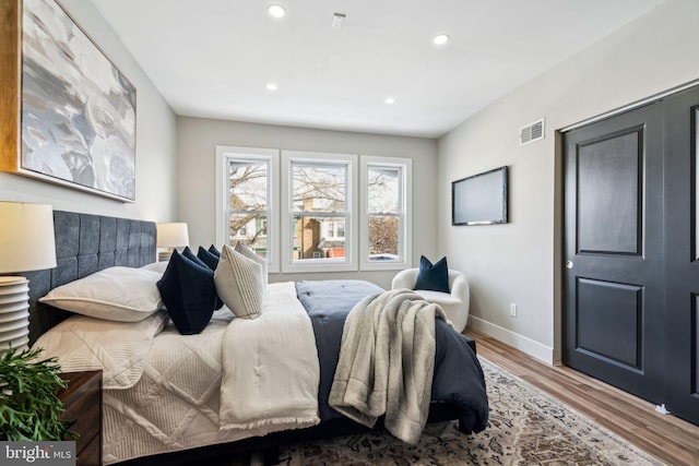 bedroom with wood-type flooring