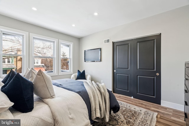 bedroom featuring light wood-type flooring