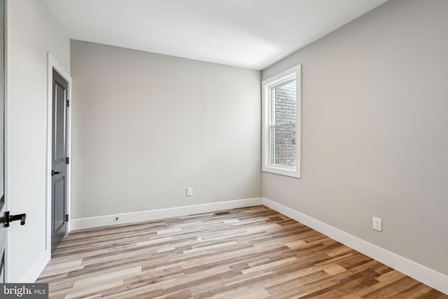 unfurnished room with light hardwood / wood-style flooring