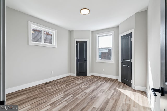 unfurnished bedroom featuring light hardwood / wood-style floors