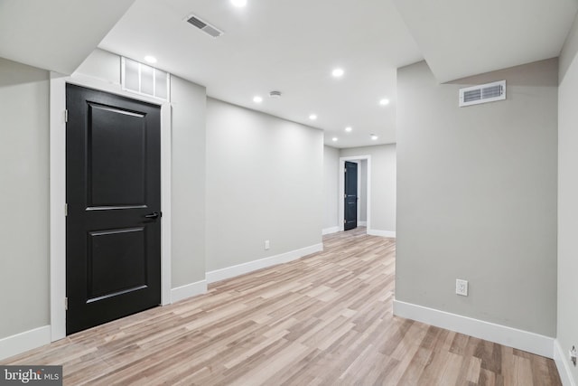 spare room featuring light hardwood / wood-style floors