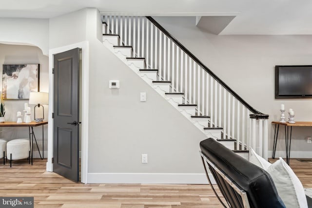 staircase featuring hardwood / wood-style flooring