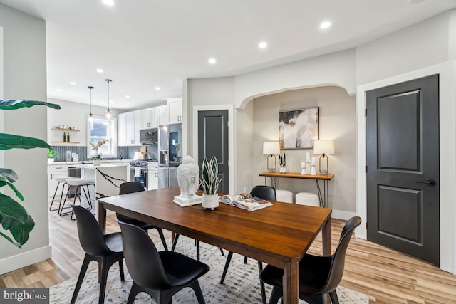 dining room with light hardwood / wood-style flooring