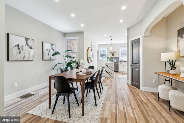 dining space featuring light hardwood / wood-style flooring