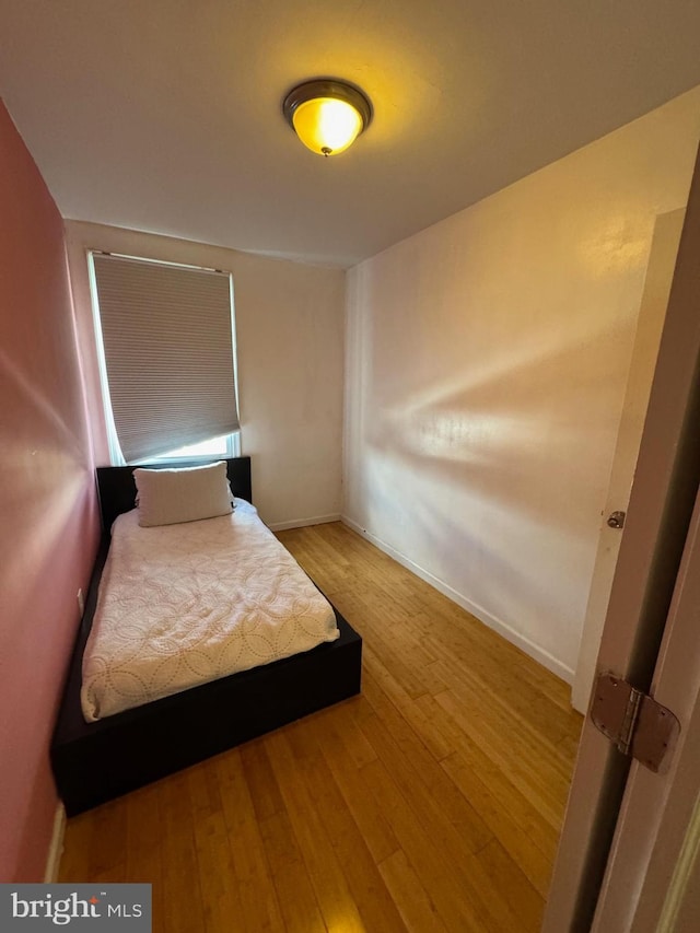 bedroom with light hardwood / wood-style flooring