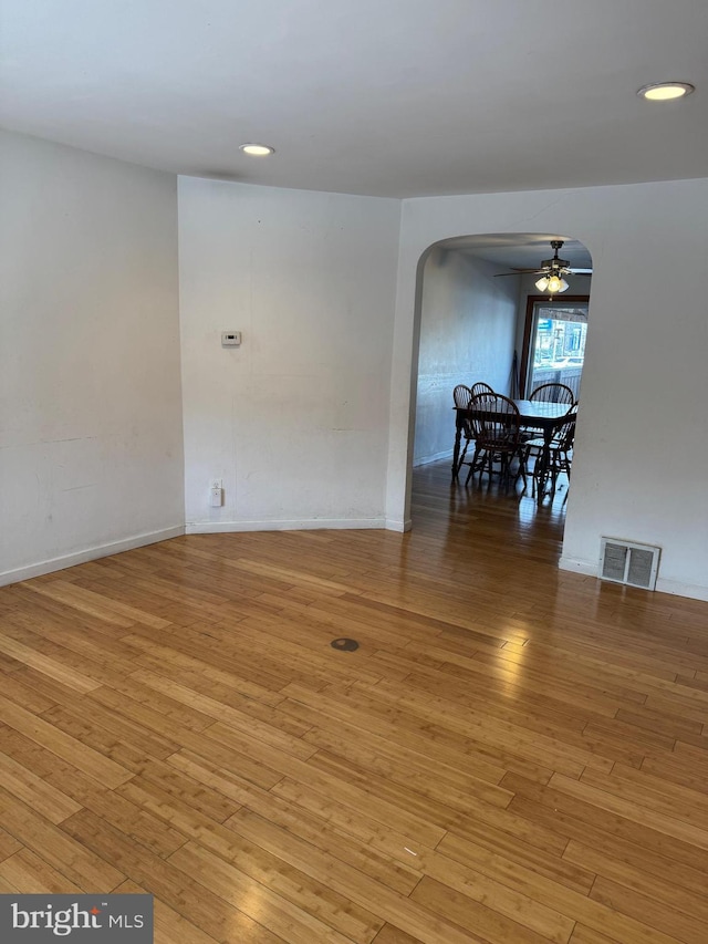 unfurnished room with ceiling fan and light hardwood / wood-style flooring