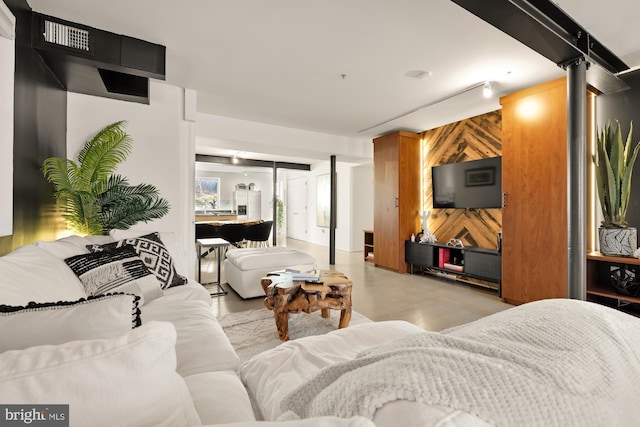 living room with wood walls