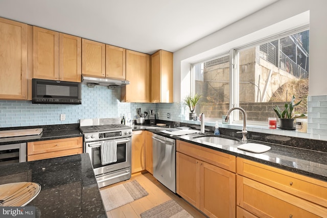 kitchen with wine cooler, tasteful backsplash, dark stone countertops, light hardwood / wood-style floors, and stainless steel appliances