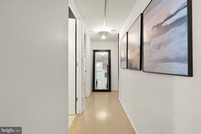 hallway featuring light wood-type flooring