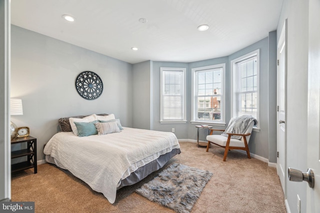 bedroom featuring light colored carpet