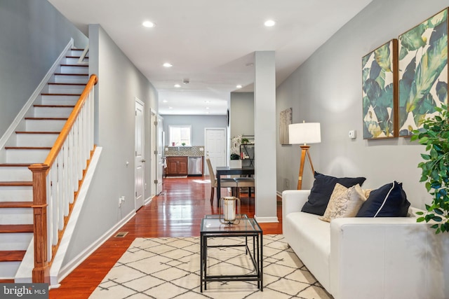 living room with light hardwood / wood-style flooring