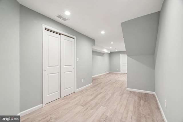 basement featuring light hardwood / wood-style flooring