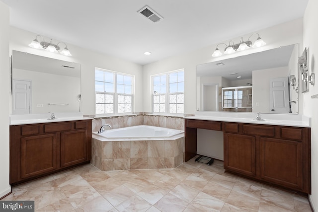 bathroom featuring vanity and shower with separate bathtub