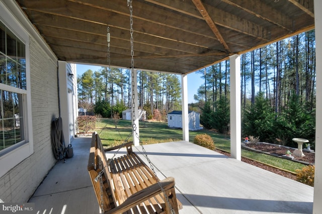 view of patio / terrace with a storage unit