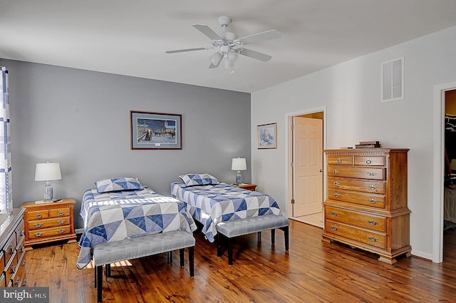 bedroom with ceiling fan and hardwood / wood-style floors