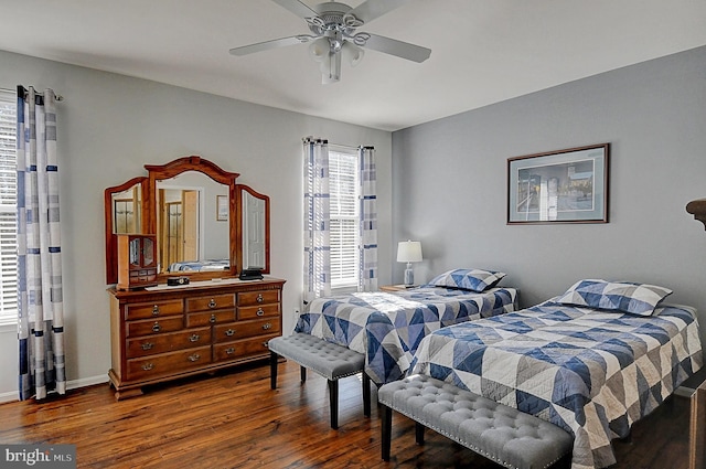 bedroom featuring ceiling fan and dark hardwood / wood-style flooring