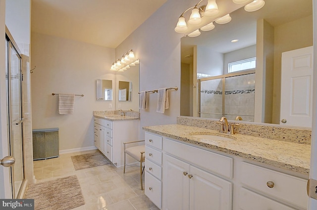 bathroom featuring walk in shower and vanity