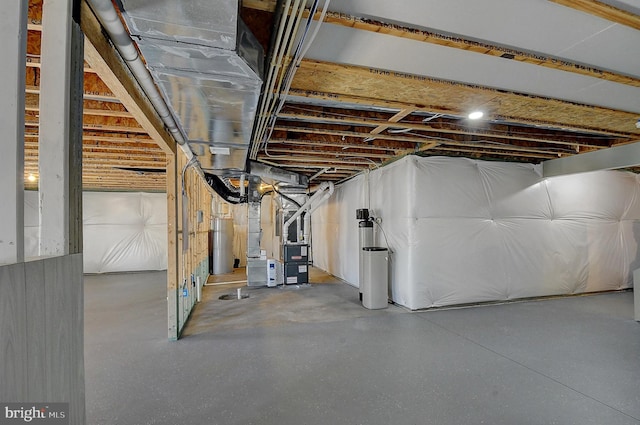 basement with heating unit and water heater