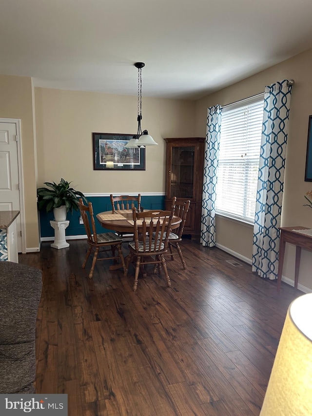 dining area featuring dark hardwood / wood-style flooring