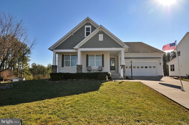 craftsman-style house featuring a garage, covered porch, and a front lawn