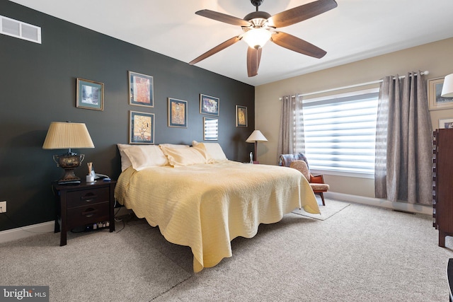 bedroom with ceiling fan and carpet flooring