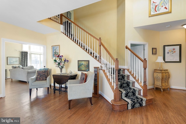 stairs with wood-type flooring