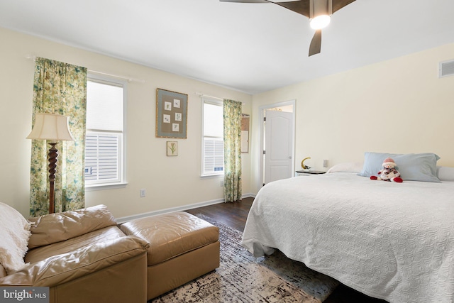 bedroom with ceiling fan and dark wood-type flooring