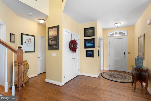 foyer entrance with dark hardwood / wood-style flooring