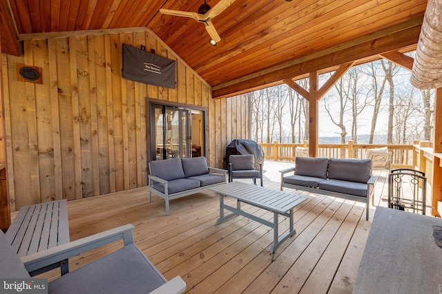 wooden terrace featuring ceiling fan and outdoor lounge area