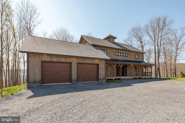 view of front of house featuring a garage and covered porch