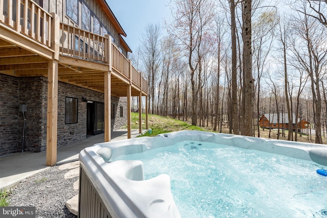 view of yard featuring a hot tub and a deck