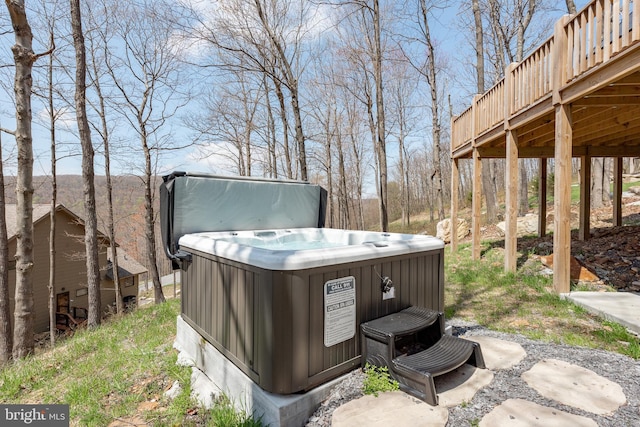 exterior details with a hot tub