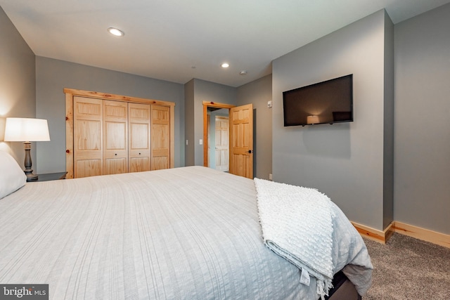 carpeted bedroom with a closet