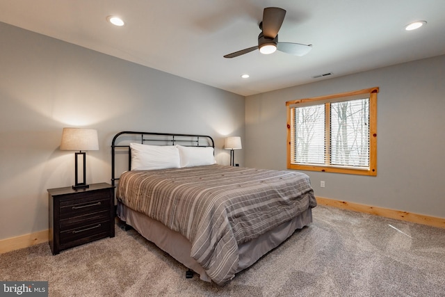 bedroom featuring light carpet and ceiling fan