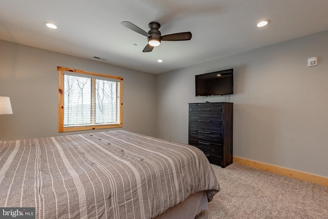 bedroom with light colored carpet and ceiling fan