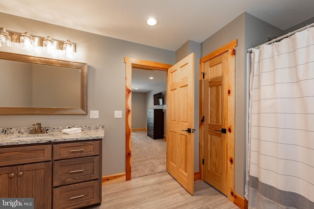 bathroom with vanity and walk in shower