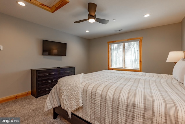 bedroom featuring ceiling fan and light carpet