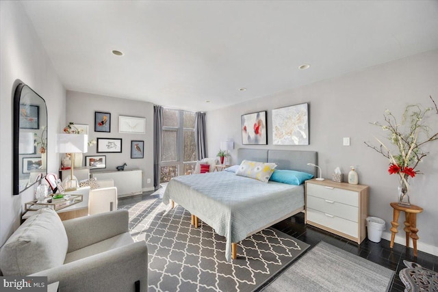 bedroom with dark wood-type flooring